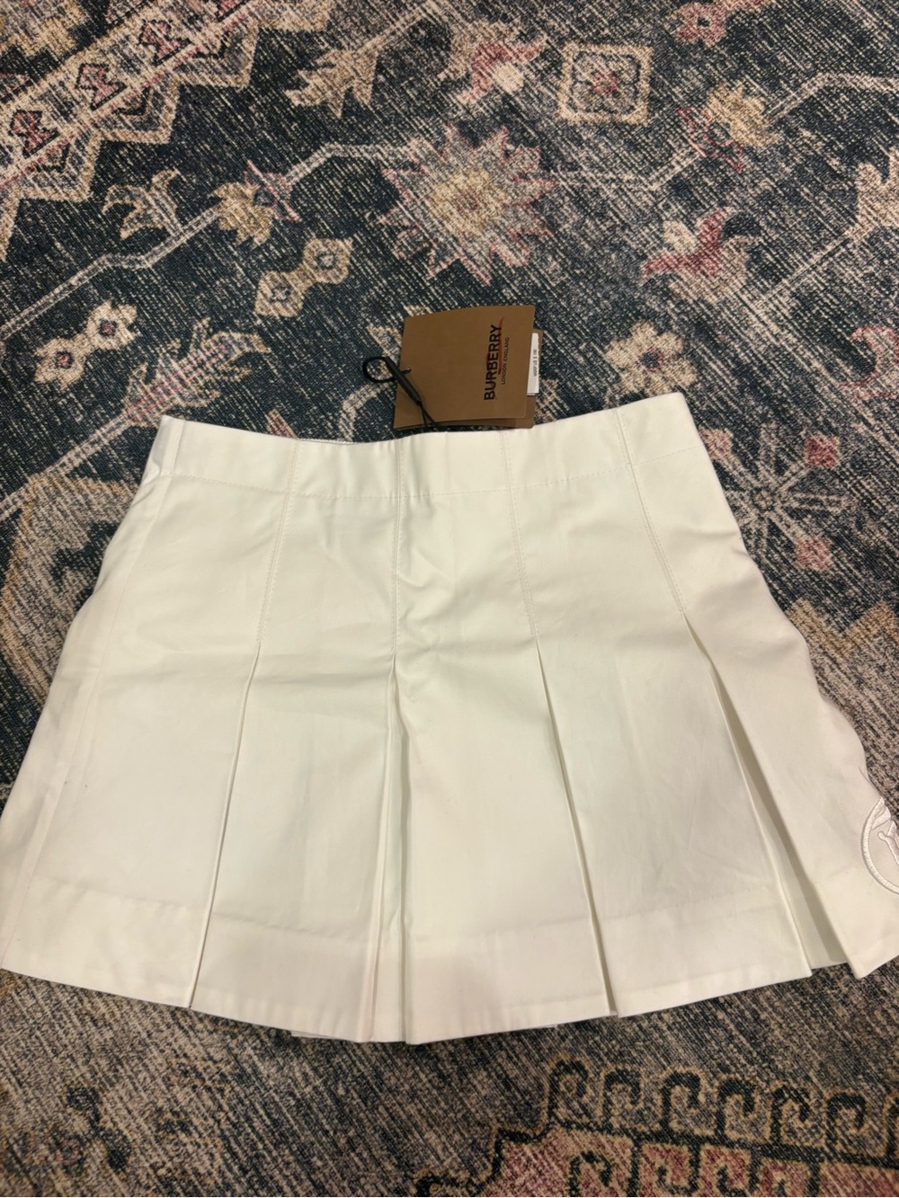 White Pleated Mini Skirt - Burberry with TB logo on the side